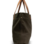 Green tote bag with brown handles on a white background