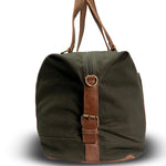 Green duffel bag with brown leather straps on a white background