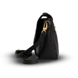 Black handbag with gold zipper on a white background