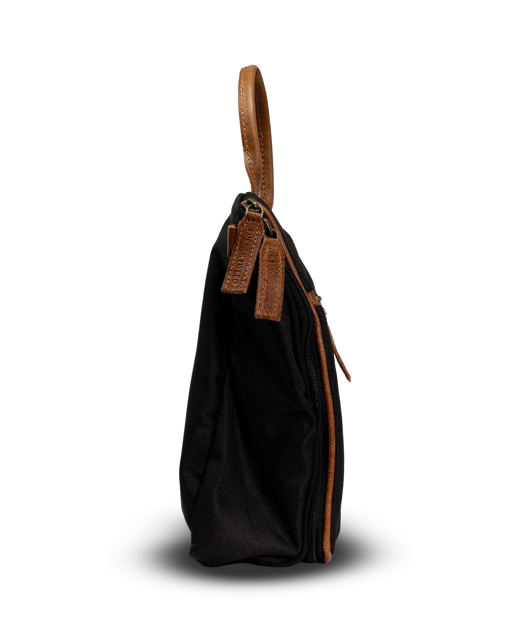 Black handbag with a brown handle on a white background
