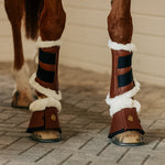 Horse wearing fleece tendon boots & bell boots in cognac by Sixteen Cypress.